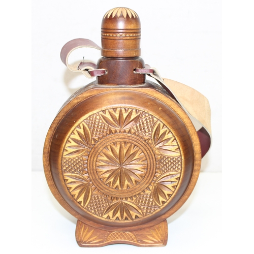 1649 - 2 Eastern European carved drink flasks with leather strapping, largest approx 27cm tall