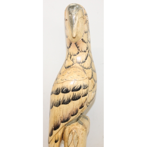 1650 - A highly decorative carved wooden parrot and a pair of long tailed warblers on stands, parrot approx... 