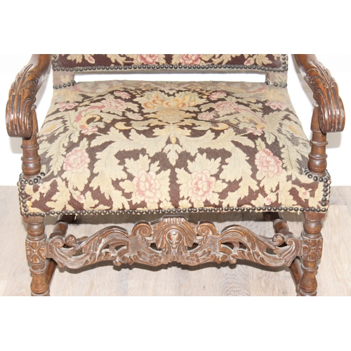 31 - A Louis 14th style armchair with exposed carved walnut frame, decorated with acanthus leaves, the fr... 