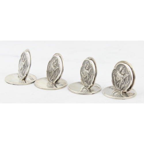 1070 - A set of 4 Edwardian silver menu or name place card holders decorated with Iris flowers, each marked... 