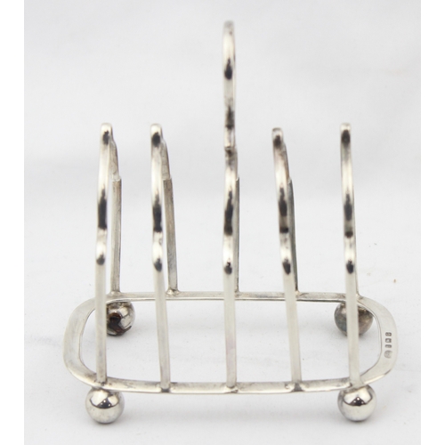 1076 - A vintage silver 4 slice toast rack, Birmingham 1931 by Alexander Clark & Co Ltd, approx 10cm wide, ... 