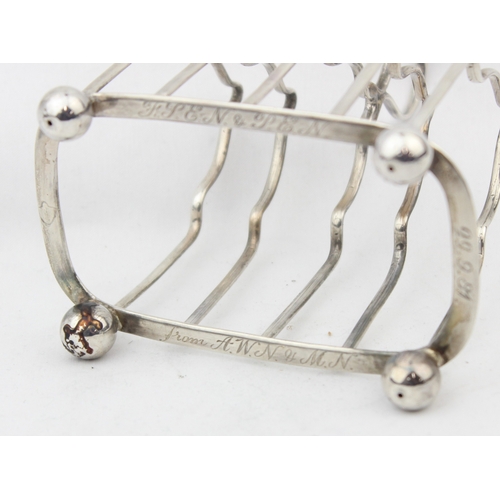 1076 - A vintage silver 4 slice toast rack, Birmingham 1931 by Alexander Clark & Co Ltd, approx 10cm wide, ... 