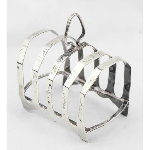 1077 - An antique silver 4 slice toast rack, Birmingham 1923 by S Blanckensee & Son Ltd, approx 8.5cm wide,... 