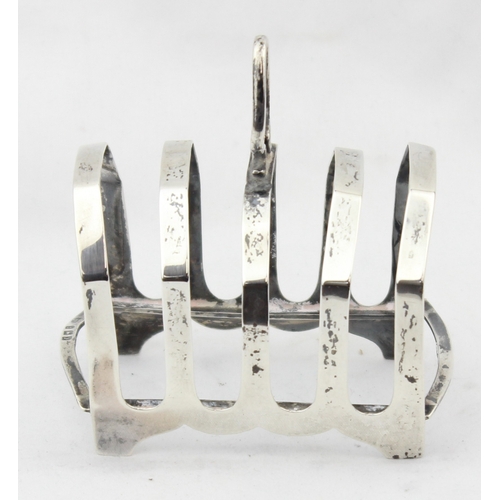 1077 - An antique silver 4 slice toast rack, Birmingham 1923 by S Blanckensee & Son Ltd, approx 8.5cm wide,... 