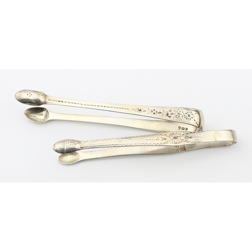 1083 - 2 pairs of antique silver sugar tongs, both with bright cut decoration, one by Hester Bateman with o... 