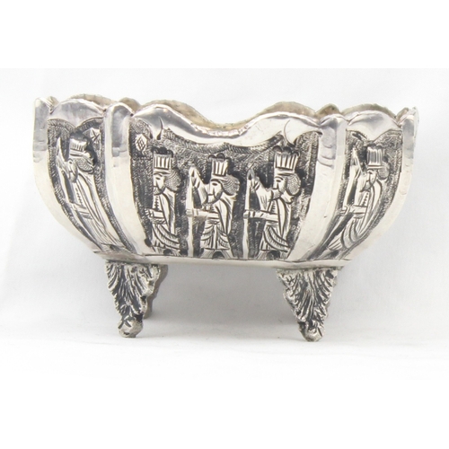 1092 - A vintage silver bowl embossed with scenes of a royal procession, indistinctly marked to base but li... 