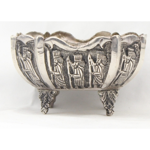 1092 - A vintage silver bowl embossed with scenes of a royal procession, indistinctly marked to base but li... 