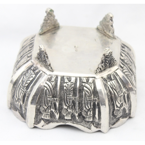 1092 - A vintage silver bowl embossed with scenes of a royal procession, indistinctly marked to base but li... 