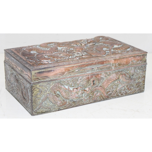 1047 - An Oriental silver plated or antimony jewellery casket decorated with dragons, unusual large size, a... 