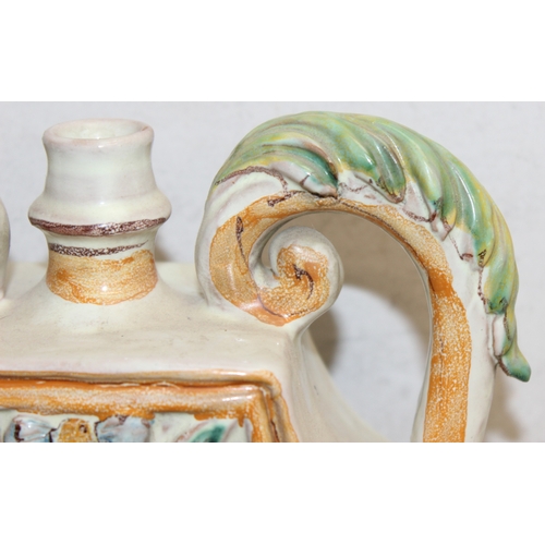 1498 - An Italian majolica (maiolica) style 2 handled releif decorated vase or vessel, marked to the back 