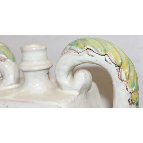 1498 - An Italian majolica (maiolica) style 2 handled releif decorated vase or vessel, marked to the back 