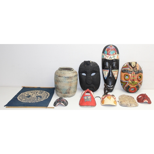 1630 - Mixed lot to incl a ceramic pottery vase, number of tribal/decorative masks, carved piece of flat st... 