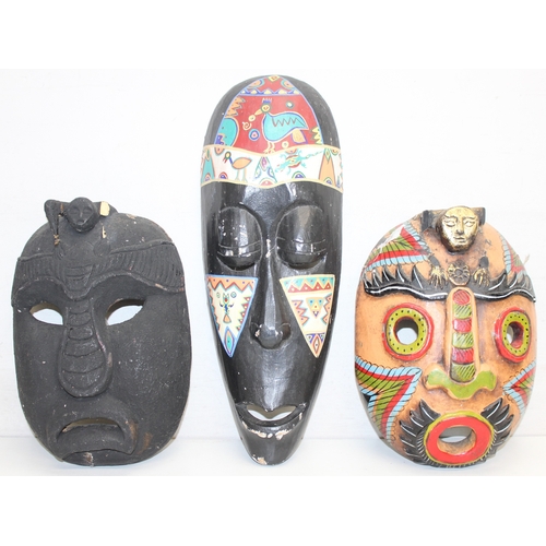 1630 - Mixed lot to incl a ceramic pottery vase, number of tribal/decorative masks, carved piece of flat st... 