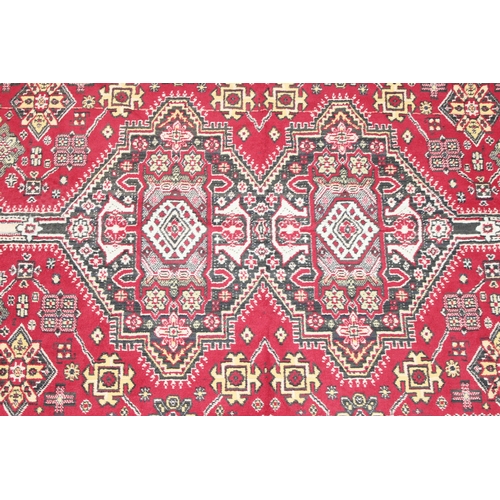 209 - A good quality red ground modern rug, no label, approx 225cm x 140cm