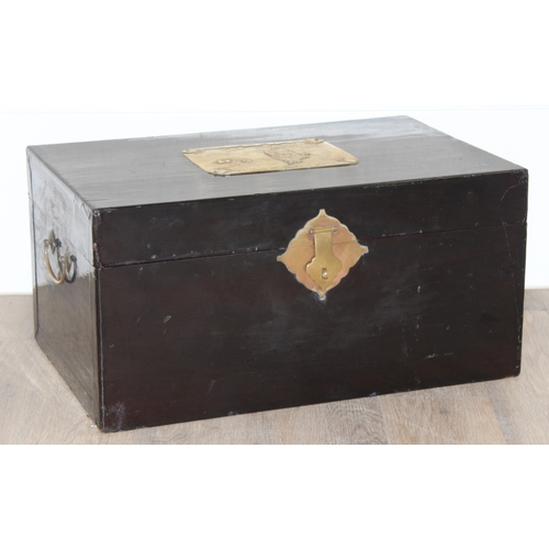 283 - A vintage Oriental black lacquered box with embossed brass fittings, approx 62cm wide x 40cm deep x ... 