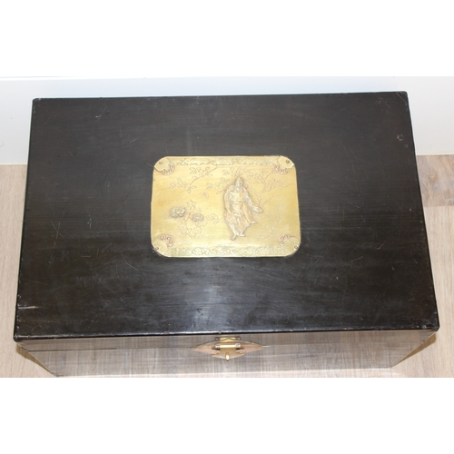 283 - A vintage Oriental black lacquered box with embossed brass fittings, approx 62cm wide x 40cm deep x ... 