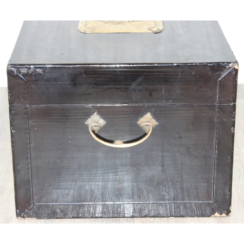 283 - A vintage Oriental black lacquered box with embossed brass fittings, approx 62cm wide x 40cm deep x ... 