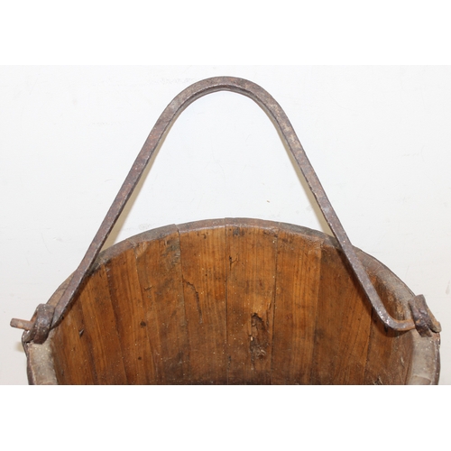 286 - Antique wooden water pale/bucket with iron attachments and banding, possibly Chinese, approx 34cm di... 