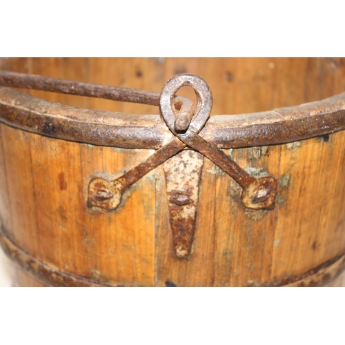 286 - Antique wooden water pale/bucket with iron attachments and banding, possibly Chinese, approx 34cm di... 