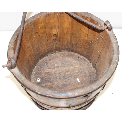 286 - Antique wooden water pale/bucket with iron attachments and banding, possibly Chinese, approx 34cm di... 