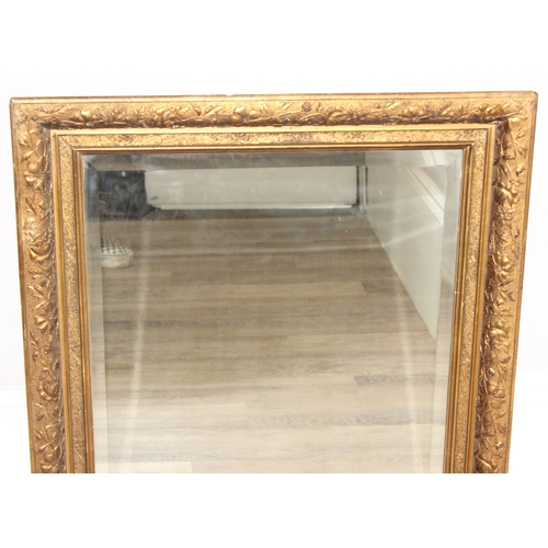 367 - An antique gilt framed wall mirror with bevelled glass panel, approx 85cm x 75cm