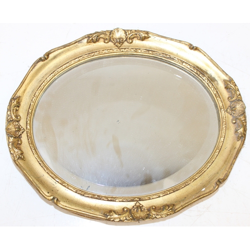 371 - 2 vintage oval shaped gilt framed wall mirrors of smaller proportions, the largest approx 31cm x 26c... 