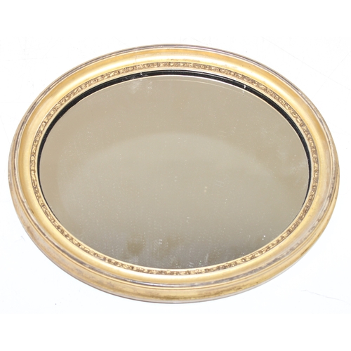 371 - 2 vintage oval shaped gilt framed wall mirrors of smaller proportions, the largest approx 31cm x 26c... 