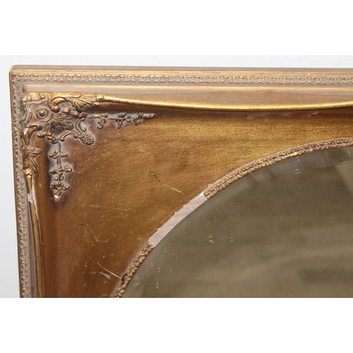 372 - A vintage gilt framed mirror with bevelled oval glass panel, approx 73cm x 63cm