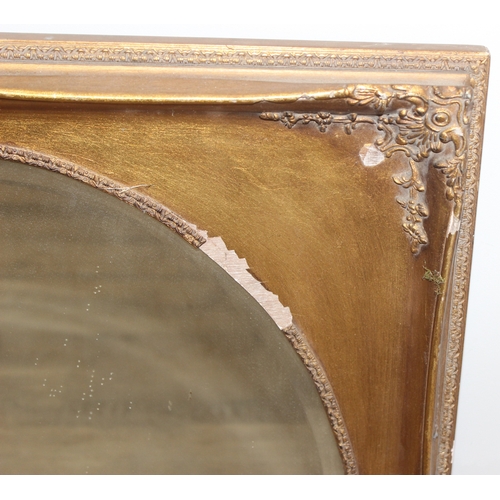 372 - A vintage gilt framed mirror with bevelled oval glass panel, approx 73cm x 63cm