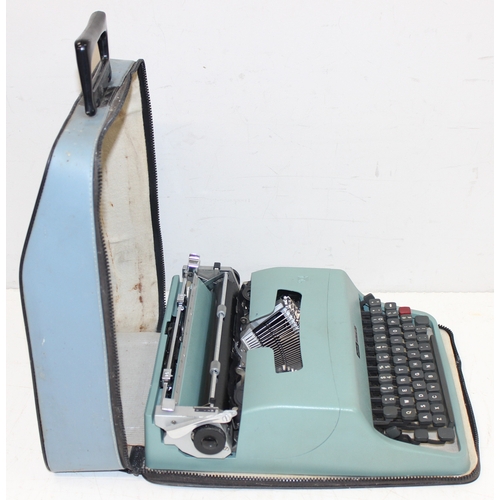 720 - 3 vintage typewriters in carry cases, to incl a Remington Rand Deluxe Model 5, Olivetti Lettera 22 a... 