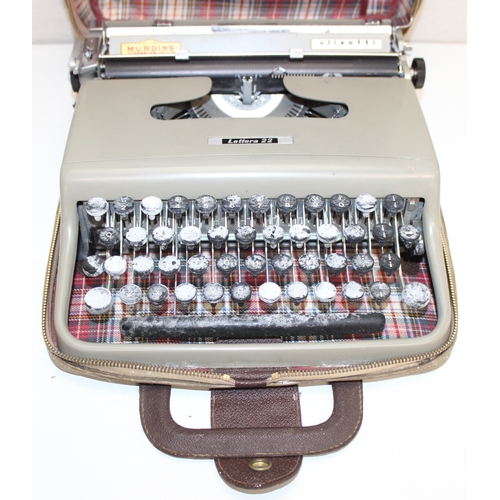 720 - 3 vintage typewriters in carry cases, to incl a Remington Rand Deluxe Model 5, Olivetti Lettera 22 a... 