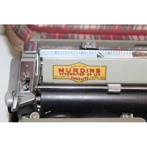 720 - 3 vintage typewriters in carry cases, to incl a Remington Rand Deluxe Model 5, Olivetti Lettera 22 a... 