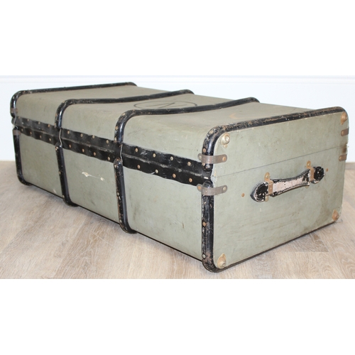 110 - 2 vintage canvas shipping trunks with wooden ribs, some labels, one brown and the other a green/grey... 