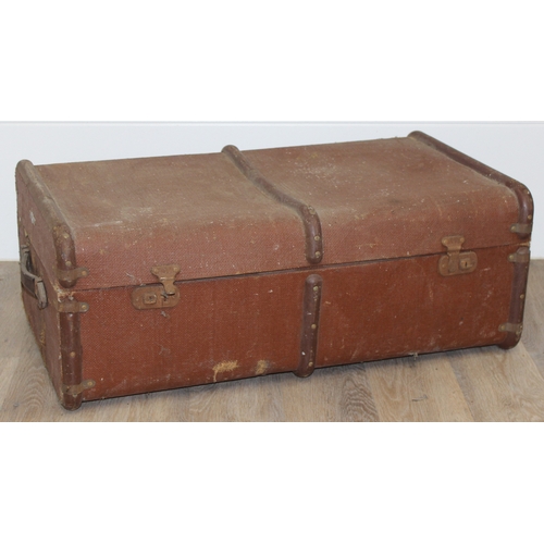 110 - 2 vintage canvas shipping trunks with wooden ribs, some labels, one brown and the other a green/grey... 