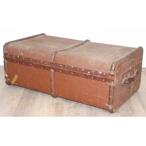 110 - 2 vintage canvas shipping trunks with wooden ribs, some labels, one brown and the other a green/grey... 