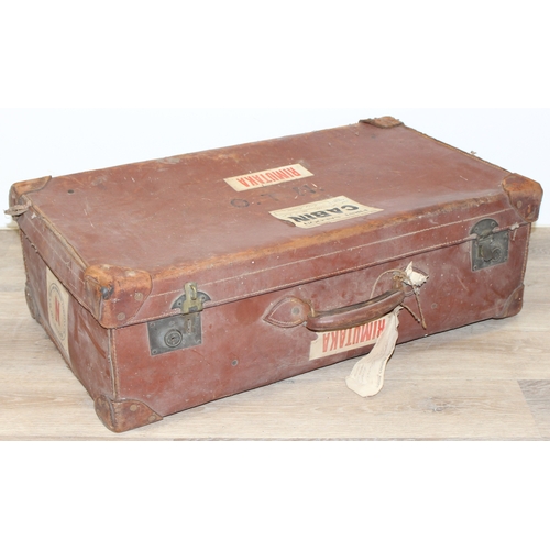 110 - 2 vintage canvas shipping trunks with wooden ribs, some labels, one brown and the other a green/grey... 