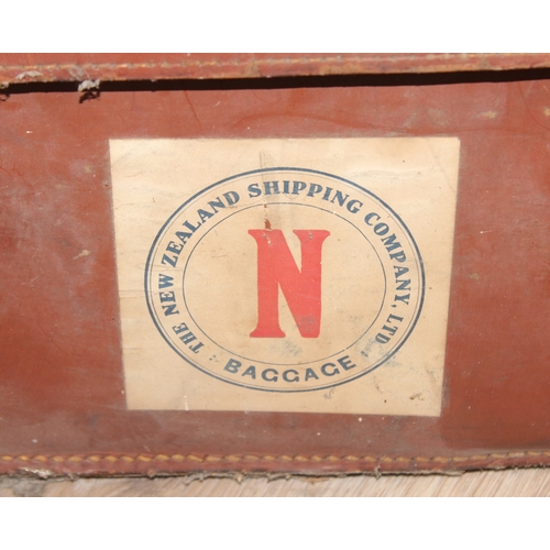 110 - 2 vintage canvas shipping trunks with wooden ribs, some labels, one brown and the other a green/grey... 