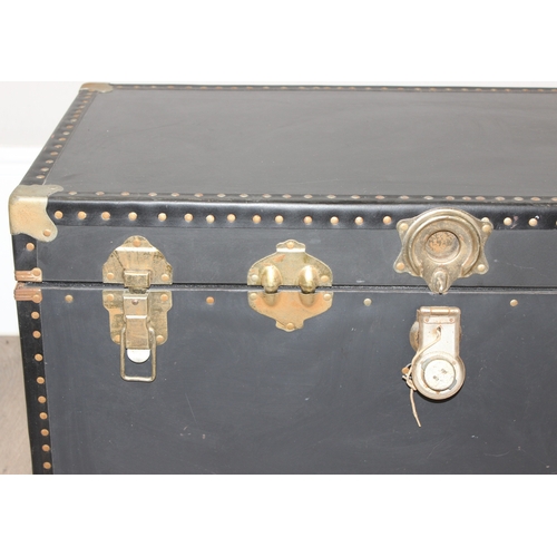 111 - A vintage style black shipping trunk with metal corners, approx 91cm wide x 51cm deep x 51cm tall