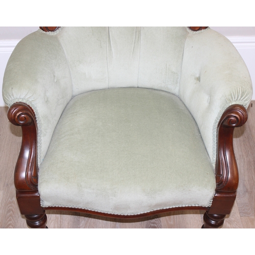 22 - A Victorian style mahogany framed button back nursing chair with brass castors and mint green uphols... 