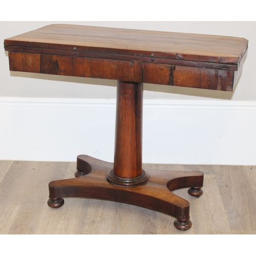 40 - A Victorian Rosewood card table with foldover top and green baize lined interior, approx 92cm wide x... 