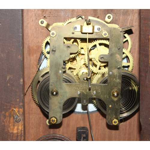 1368 - An early 20th century mahogany cased mantle clock with mechanical movement, key and pendulum, approx... 