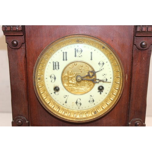 1368 - An early 20th century mahogany cased mantle clock with mechanical movement, key and pendulum, approx... 