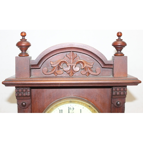 1368 - An early 20th century mahogany cased mantle clock with mechanical movement, key and pendulum, approx... 