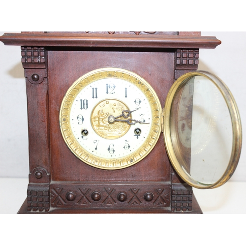 1368 - An early 20th century mahogany cased mantle clock with mechanical movement, key and pendulum, approx... 