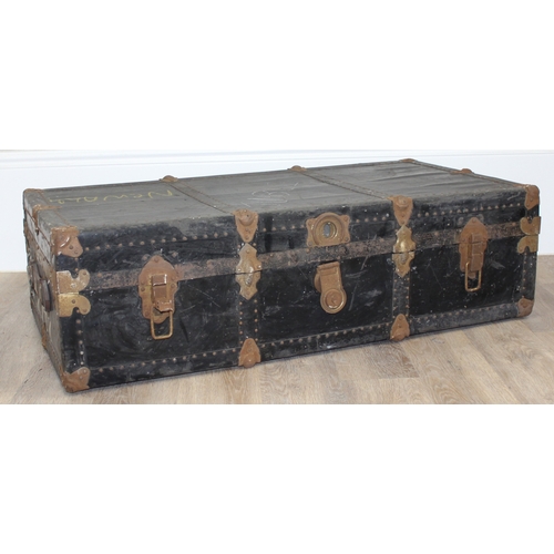 105 - 2 vintage black shipping trunks with metal bound corners, both without makers marks, the largest app... 