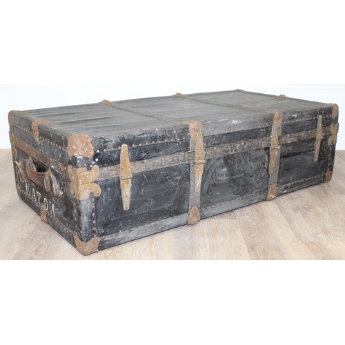 105 - 2 vintage black shipping trunks with metal bound corners, both without makers marks, the largest app... 