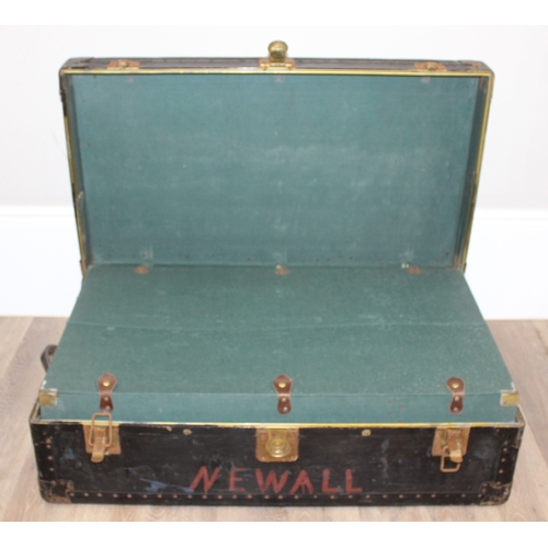 105 - 2 vintage black shipping trunks with metal bound corners, both without makers marks, the largest app... 