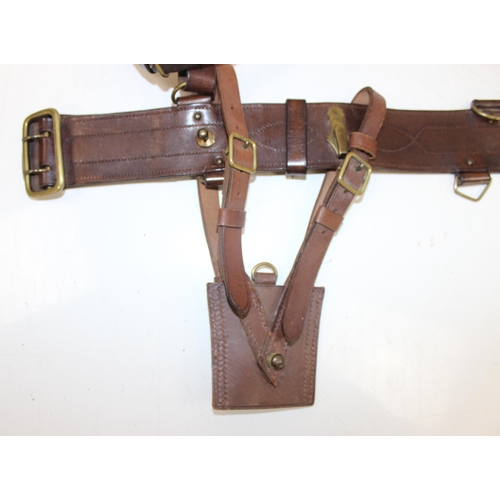 1447 - A vintage military officer's Sam Brown leather-belt with pistol holster and sword hanger