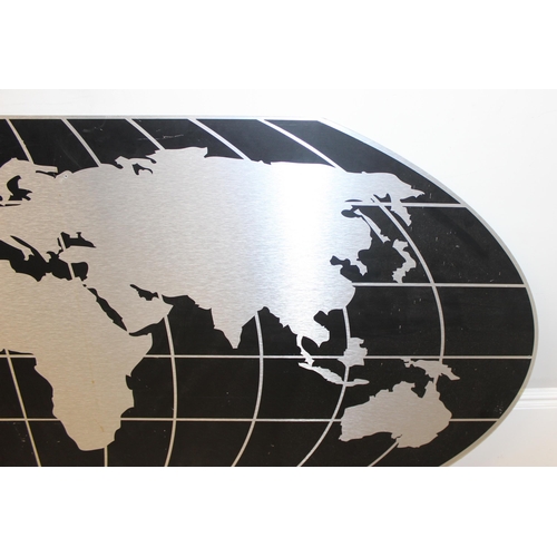 387 - A large black and aluminium wall map of the globe, Robinson projection, approx 232cm x 104cm