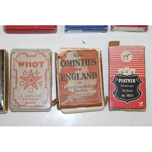 632 - A large qty of assorted vintage playing cards and playing card related games